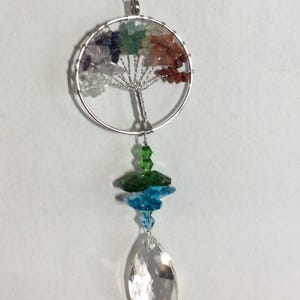 Genuine Gemstone Tree of Life Sun catcher, with several crystals on top , with a 38mm  crystal on bottom .  Great Gift.
