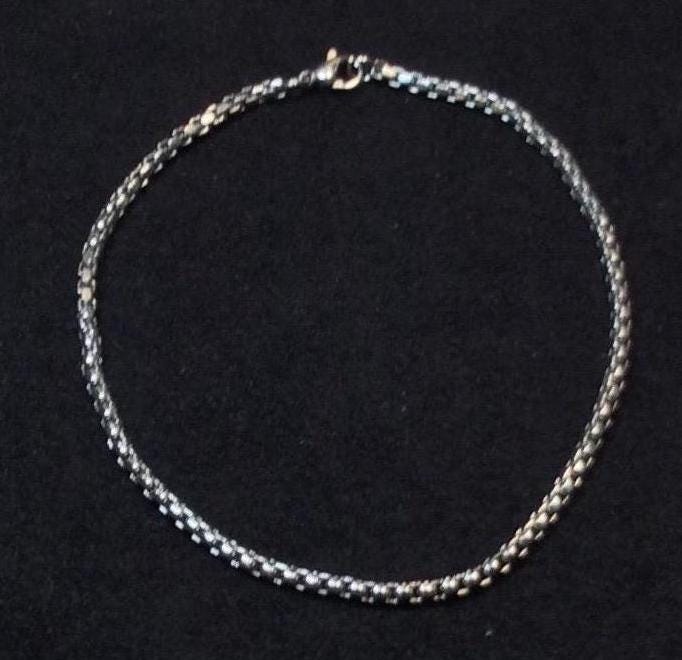 Tobillera, pulsera o gargantilla de acero inoxidable con forma de arcoíris, dorado, plateado y negro, de 5" a 14" de diámetro. No se deslustra, es resistente al agua.