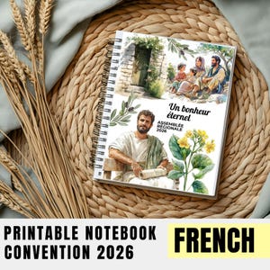 Peut inclure: Un carnet à spirales avec une couverture illustrée et le texte "Un bonheur éternel" et "Assemblée Régionale 2026." Le carnet est posé sur un tapis tressé avec des épis de blé. Le bas de l'image indique "PRINTABLE NOTEBOOK CONVENTION 2026 FRENCH."