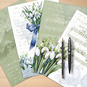 Puede incluir: Cuatro hojas de papel con diferentes dise&ntilde;os. La hoja superior presenta un ramo de flores de campanilla de invierno blancas con una cinta azul. La segunda hoja tiene una carta manuscrita con un dise&ntilde;o floral. La tercera hoja tiene una partitura musical con las palabras "Boston" y "London" visibles. La cuarta hoja tiene una partitura musical con las palabras "Boston" y "London" visibles.