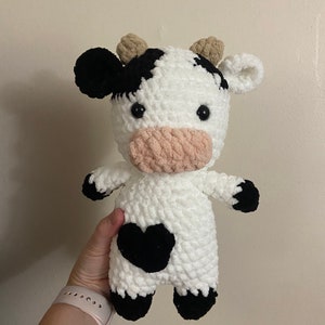 Black and white cow plushie