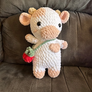 Strawberry cow plushie with removable strap