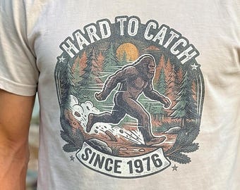 Bigfoot T-Shirt & Hoodie "Hard to Catch Since 1976" | Sasquatch Running Design