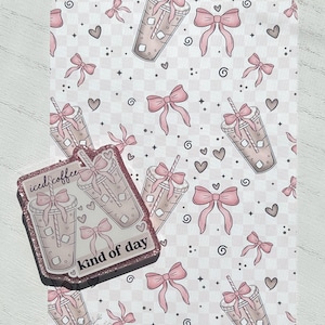 May include: A pink and white patterned decorative mat with a matching coaster. The mat features a repeating pattern of iced coffee drinks, bows, and hearts. The coaster has the text "iced coffee kind of day".