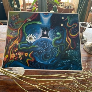 May include: A colorful, abstract painting depicting a woman's torso with a swirling galaxy inside. The woman is surrounded by flowers, butterflies, snakes, and a turtle. The painting is done in a vibrant style with a mix of blue, green, yellow, and red colors.