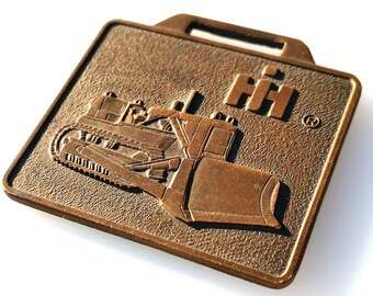 A Metal Arts Rochester New York International Harvester Crawler Advertising Pocket Watch Fob