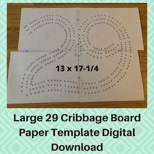 May include: A digital download template for a large 29-peg cribbage board. The template is printed on white paper and shows the layout of the board with the dimensions 13 x 17-1/4 inches.