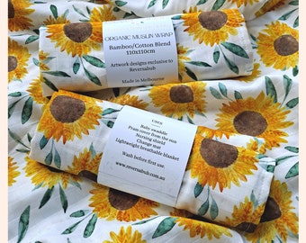 Muslin swaddle wrap blanket featuring exclusive Sunflowers print - luxuriously soft organic bamboo/cotton blend for babies delicate skin.