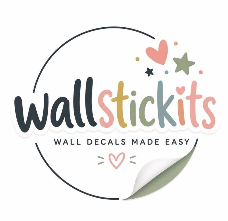 May include: A logo for wallstickits featuring the text wallstickits in multicolored rounded letters, with the tagline WALL DECALS MADE EASY below. The design includes a circular border, a small heart, a star, and a peeling corner effect.