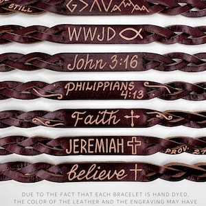 May include: A set of eight brown leather bracelets with various engraved messages, including "Be Still", "G>AVA", "WWJD", "John 3:16", "Philippians 4:13", "Faith", "Jeremiah", and "Believe".