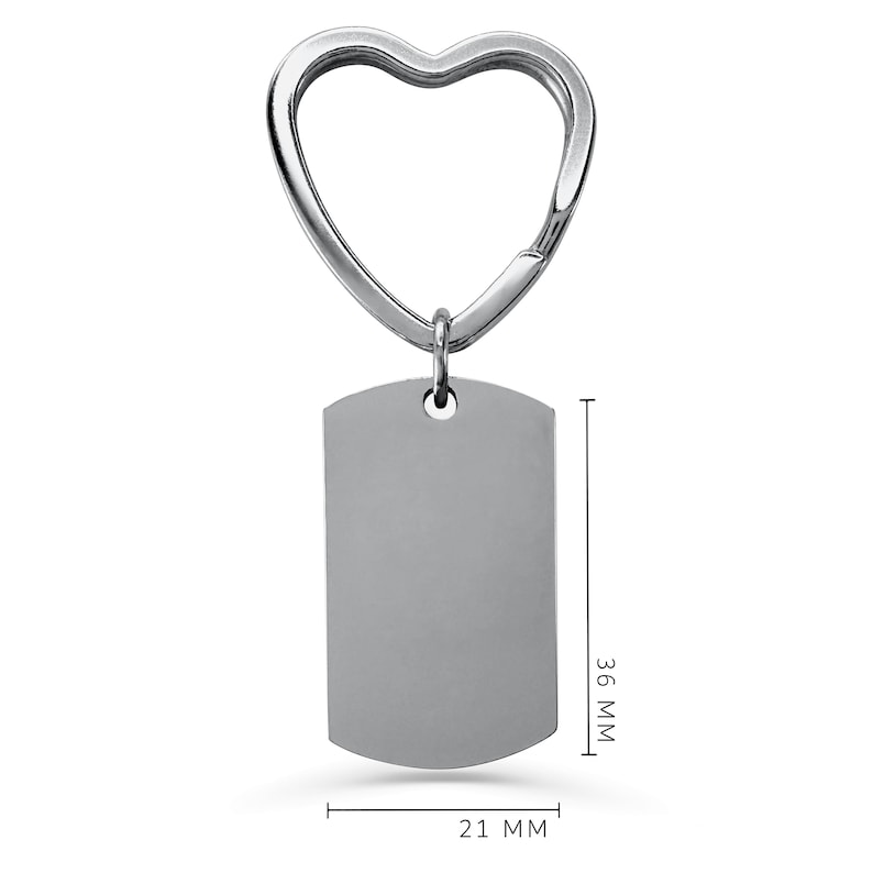 May include: Silver heart-shaped keyring with a blank rectangular tag. The tag measures 36 mm by 21 mm.