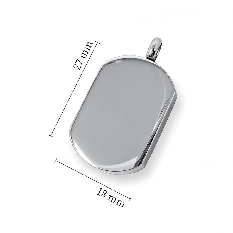 May include: A polished silver pendant in a rectangular dog tag shape, measuring 27 mm long and 18 mm wide. The pendant has a rounded top with a loop for a chain.