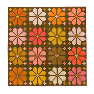May include: A quilt with a repeating pattern of stylized flowers in shades of pink, orange, yellow, and brown on a dark green background.
