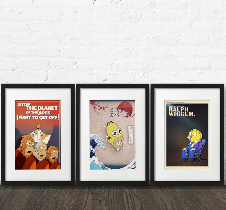 May include: Three framed prints with different designs. The first print features a scene from the movie "Planet of the Apes" with the text "Stop the Planet of the Apes, I Want to Get Off!" The second print features a yellow cartoon character with the text "Mister Sparkle" in Japanese. The third print features a cartoon character with the text "Ralph Wiggum".