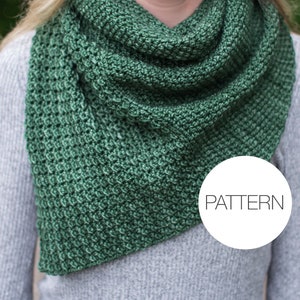 May include: A green knitted infinity scarf with a textured stitch pattern. The scarf is worn by a person and the word "PATTERN" is visible in a white circle.