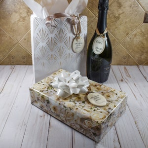 Editable gift tags used on gift bag, on wrapped gift, and on hanging on bottle of champagne.
