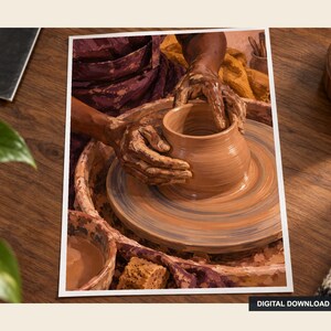 May include: A digital download print showing a person shaping a wet clay pot on a spinning pottery wheel. The hands are covered in brown clay, working the circular vessel. A small bowl of water and a sponge are visible near the wheel.