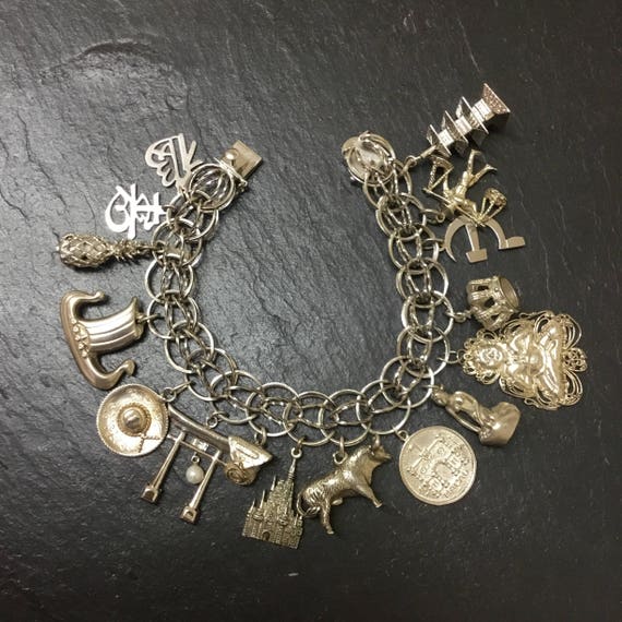 Sterling Silver Charm Bracelet 1950's/1960's | Etsy | Charm bracelet, Sterling  silver charm, Vintage charm bracelet