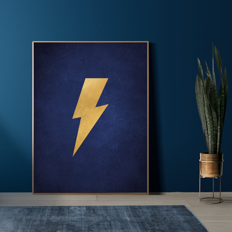 May include: A framed print with a gold lightning bolt on a dark blue background.