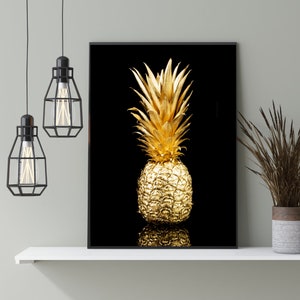 May include: A gold pineapple on a black background. The pineapple is a popular tropical fruit and a symbol of hospitality.