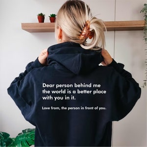 May include: Black hooded sweatshirt with the text "Dear person behind me the world is a better place with you in it. Love from, the person in front of you."