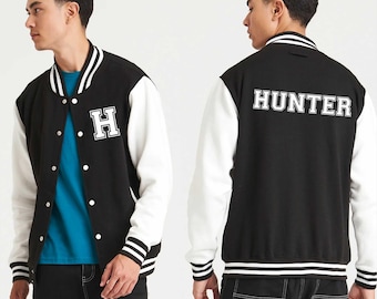 May include: Two black and white varsity jackets with contrasting sleeves. One jacket has a white "H" on the left side of the chest. The other jacket has "HUNTER" in white lettering on the back.