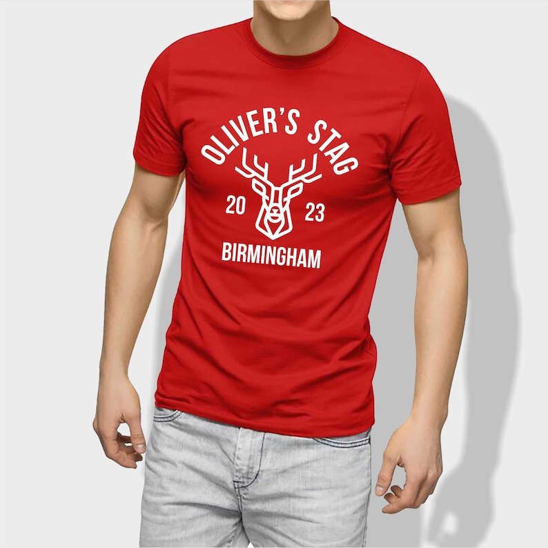 May include: Red t-shirt with a white stag graphic and the text "Oliver's Stag 20 23 Birmingham".