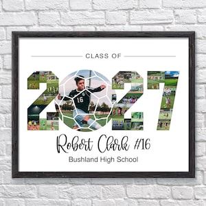 May include: A framed photo collage print featuring the text CLASS OF 2027, with the numbers 2027 filled with various soccer action shots. A central soccer ball graphic features a player in a black jersey. Robert Clark #16 Bushland High School.
