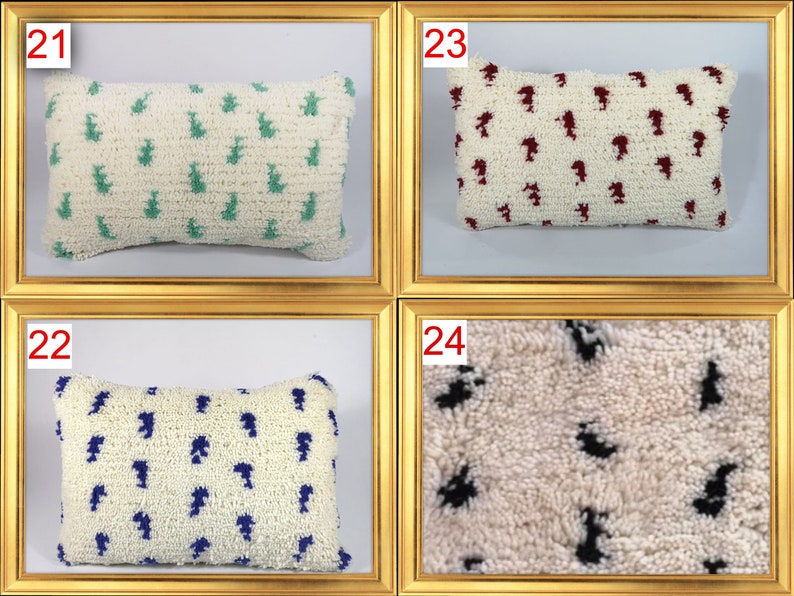 May include: Four white throw pillows with different colored patterns. The pillows have a fluffy texture and are arranged in a grid pattern. The pillows are numbered 21, 22, 23, and 24.