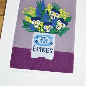 May include: A colorful floral print featuring a bouquet of blue, yellow, and white flowers in a white vase with the word "&Eacute;PICES" printed on it. The print has a purple and lavender background. The print is on a white background.