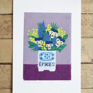 May include: A print featuring a floral arrangement in a white pot with the word "&Eacute;PICES" on it. The flowers are blue, yellow, and white, set against a purple background. The print is signed and numbered.
