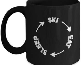 Skiing Mug, Eat Sleep Ski Mug is a Great Skiing Gift For Skier! Get Our Black Ceramic Mug and Deliver a Perfect Ski Gift Coffee Mug Today!