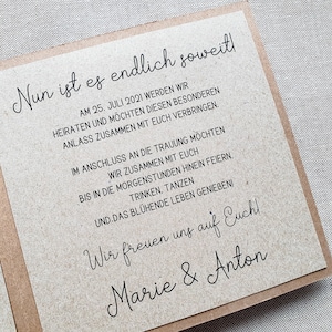 May include: A rustic brown card with black text announcing a wedding. The text reads "Nun ist es endlich soweit!" followed by the date "AM 25. JULI 2021" and details about the wedding celebration. The card is signed "Marie & Anton".