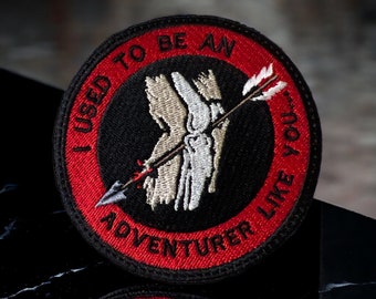 Skyrim Inspired Patch - 'I Used to be an Adventurer Like You...' - Arrow Through the Knee - Iron On-Sew On-Hook 3.51" X 3.52"