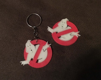 Glow in the dark Ghostbusters logo keychains or fridge magnets