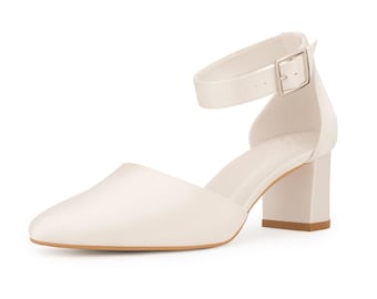May include: White satin heeled sandals with an ankle strap and buckle closure.