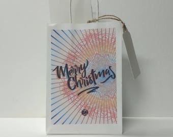 Small (5x8") holiday gift bags, with name tag and tissue paper. Mix and match