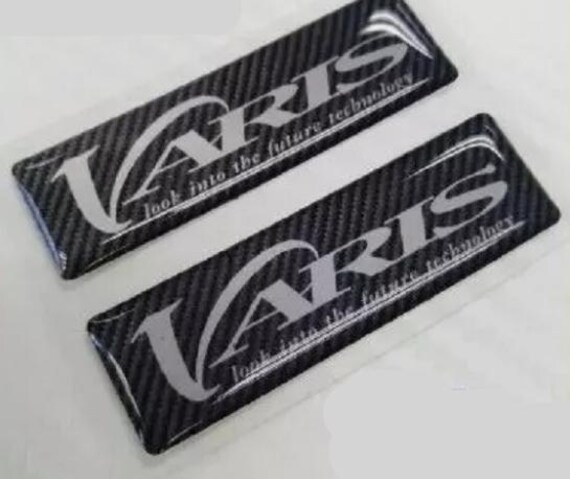 thumbnail image 2 of Varis Epoxy Export Spec Rubble Badge Emblem - Glossy Black 50mm X 15mm, Adhesive Mount 2 of 6