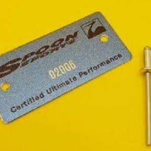 May include: A silver metal tag with the text "Spoon" and "Certified Ultimate Performance" and the number "02006". Two silver metal rivets are included.