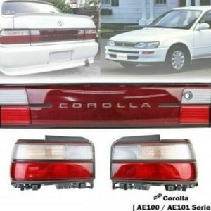 May include: Red and white tail lights for a Toyota Corolla AE100/AE101 series car. The tail lights are in new condition and have a red, white, and clear plastic construction.