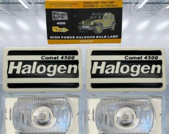 May include: Two white halogen headlights with black trim and the text "Comet 4500 Halogen" on each. The headlights are on a white surface.