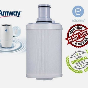 May include: A white water filter cartridge with a gray top and a white label that says "eSpring". The filter is surrounded by a red and white sticker that says "Ready Stock".