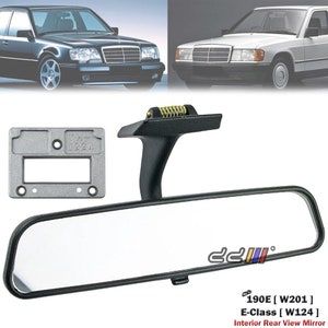 May include: Black interior rear view mirror for a Mercedes-Benz 190E (W201) or E-Class (W124). The mirror has a black plastic frame and a rectangular glass surface. The text "190E [W201] E-Class [W124] Interior Rear View Mirror" is printed on the bottom of the mirror.