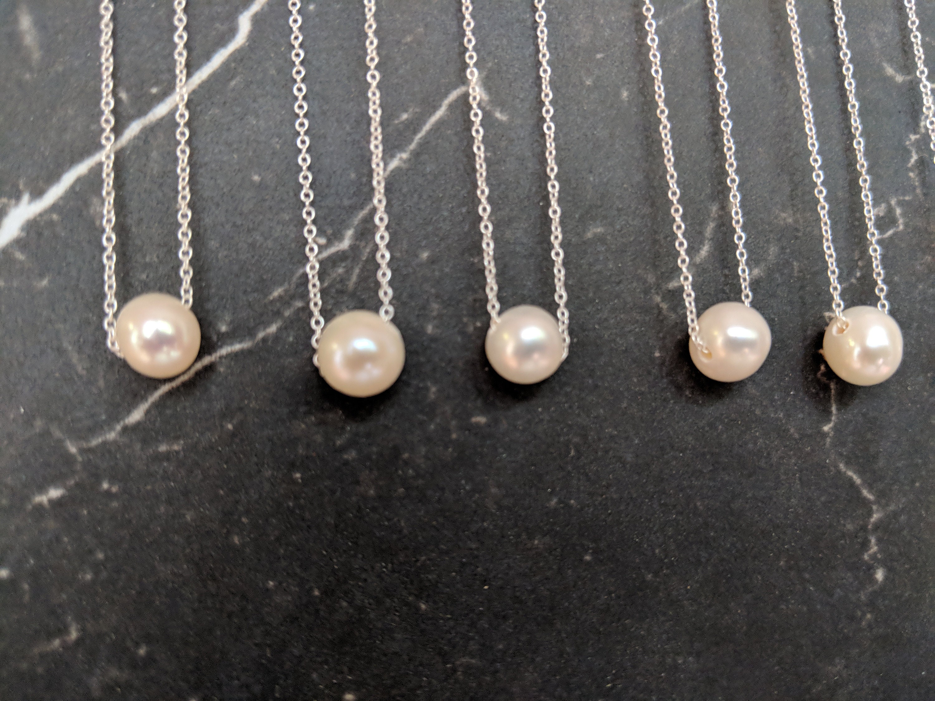 Solitaire floating hotsell pearl necklace