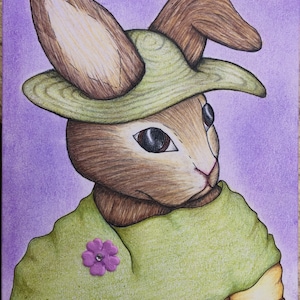 May include: A brown rabbit wearing a green hat with a brown brim and a green scarf with a purple flower pin. The rabbit has brown fur and black eyes. The background is a purple gradient.