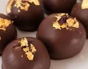Heavenly Belgian Dark Chocolate Champagne Truffles with edible gold flakes.