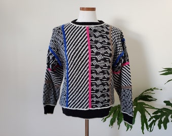 1980s geometric abstract pullover sweater, black and white with pink, blue and gold, medium, acrylic