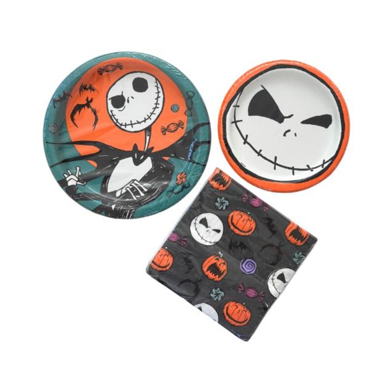 May include: Halloween-themed party supplies featuring Jack Skellington. Includes two paper plates with Jack's face and a napkin with pumpkins and Jack's face. The plates have orange and teal backgrounds.
