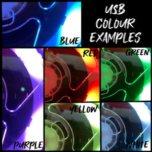 May include: A close-up of a USB-powered light that can be changed to different colors. The light is shown in blue, red, green, yellow, purple, and white.