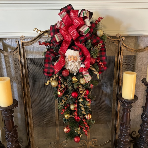 Christmas Tear Drop Swag  wreath featuring a 3 layer bow and Santa Face